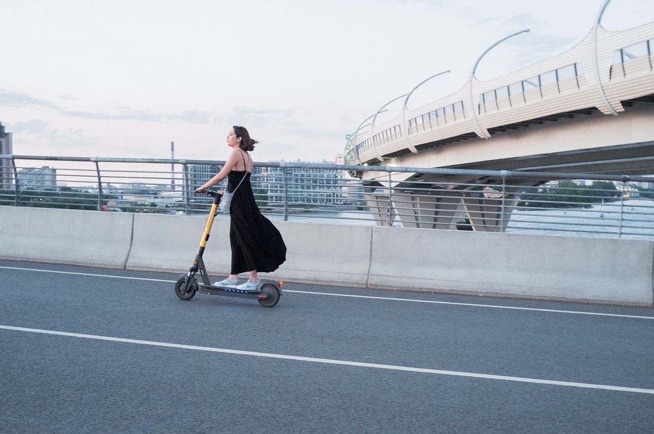 our-story woman, electric scooter, street, scooter, transportation, city, e-scooter, electric scooter, electric scooter, scooter, scooter, scooter, scooter, scooter